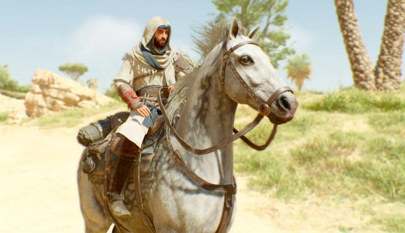 Best new games: Basim is riding a horse in the desert in Assassin's Creed Mirage.